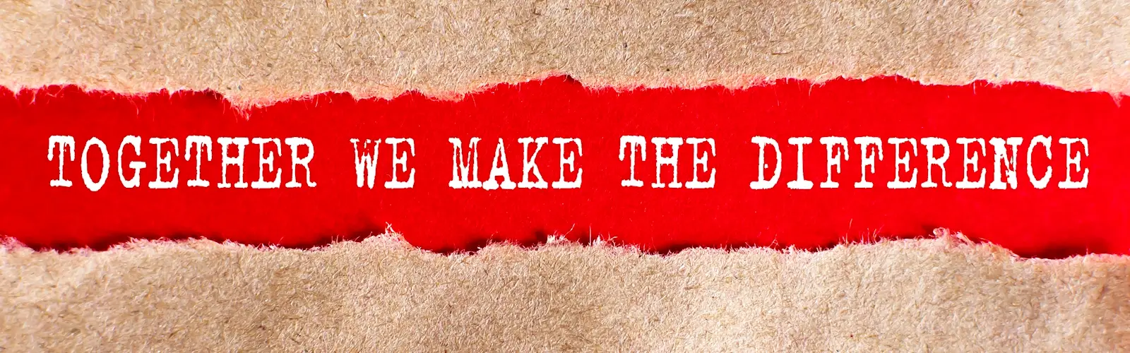 Torn brown paper revealing red card with the words 'Together we make the difference'